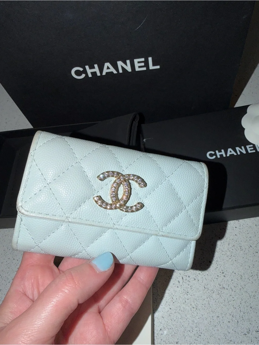 Chanel shiny caviar quilted crystal CC flap card holder light blue
